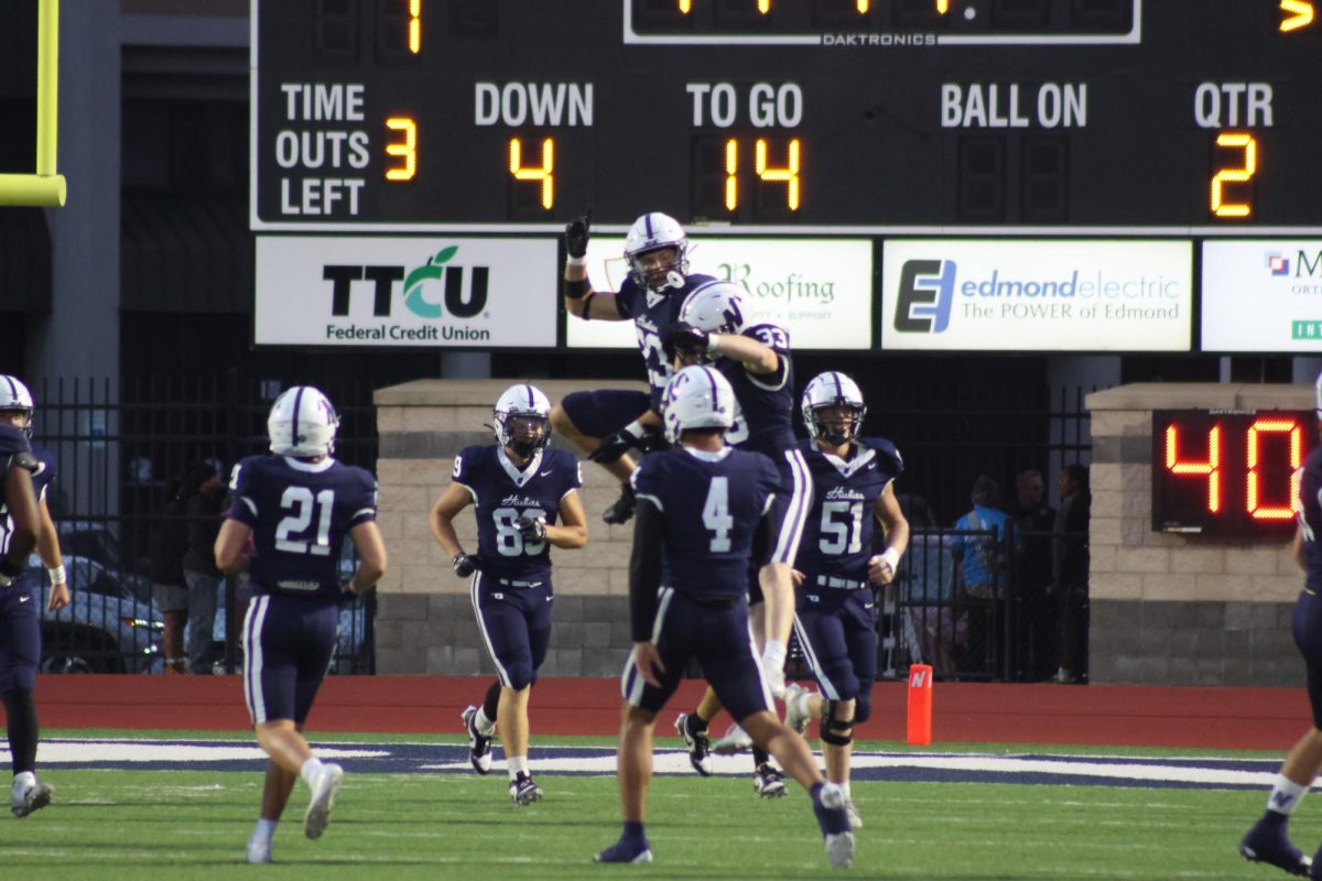 Huskies celebrating after touchdown.