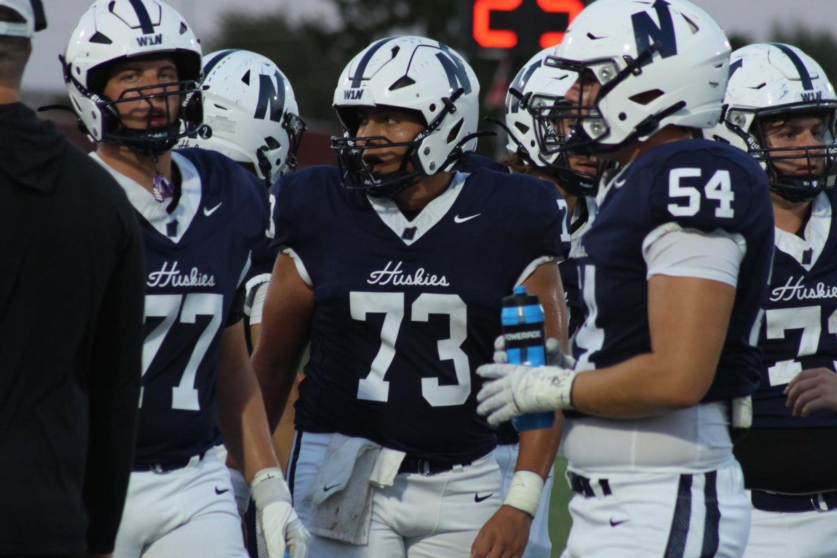 Husky offensive line planning their next play.