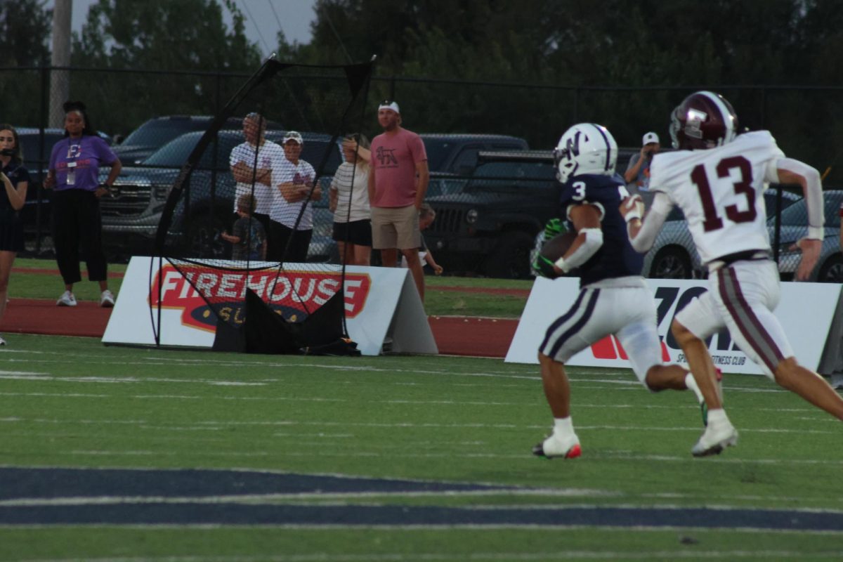 Number 3 running the ball into the end zone.