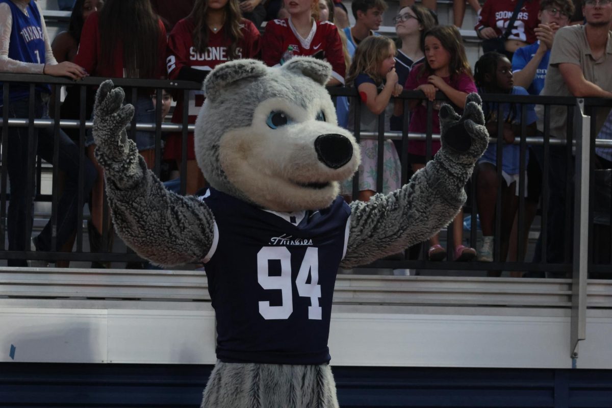 Husky mascot celebrating after touchdown.