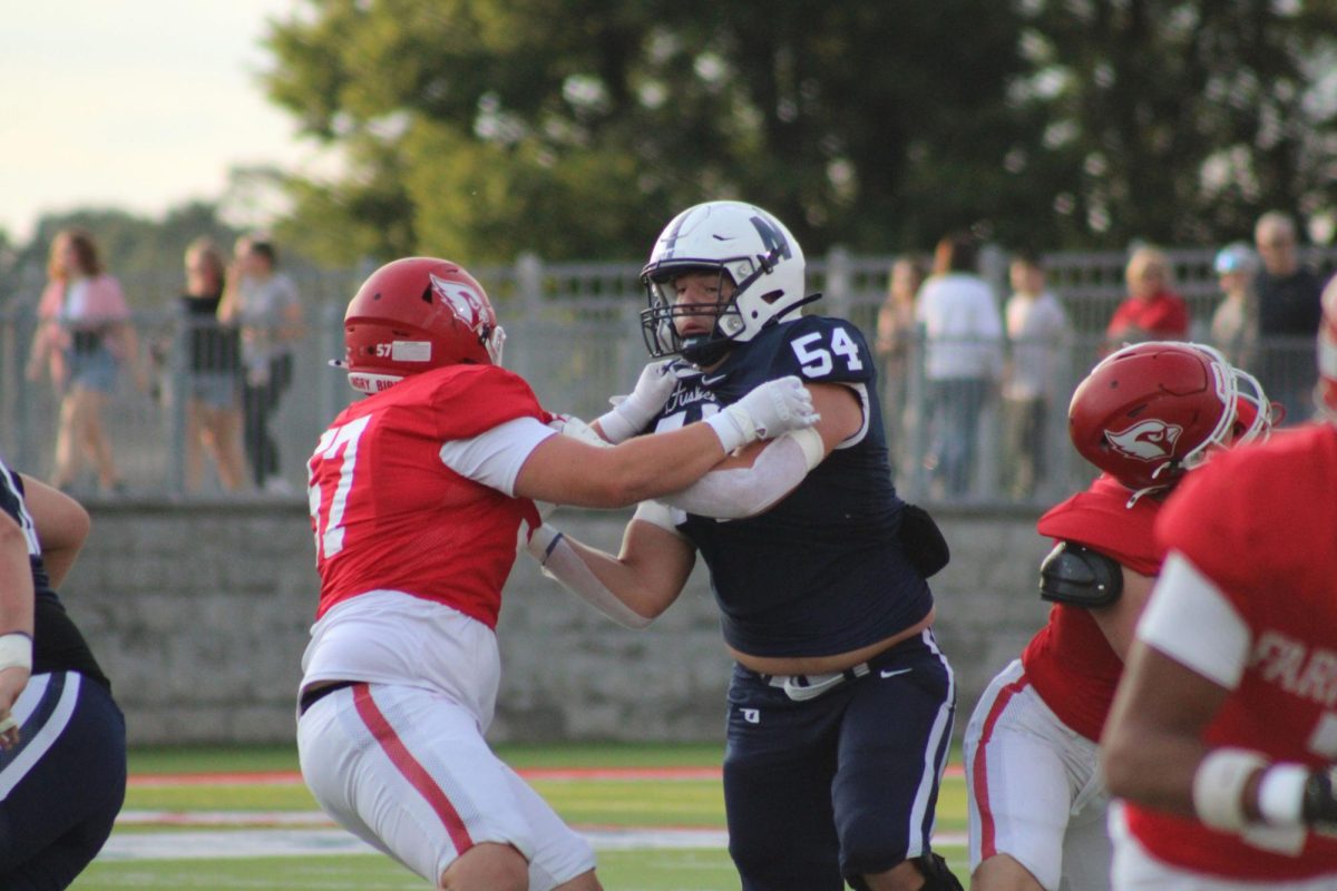 Number 54 blocking the Farington Cardinals defensive line.