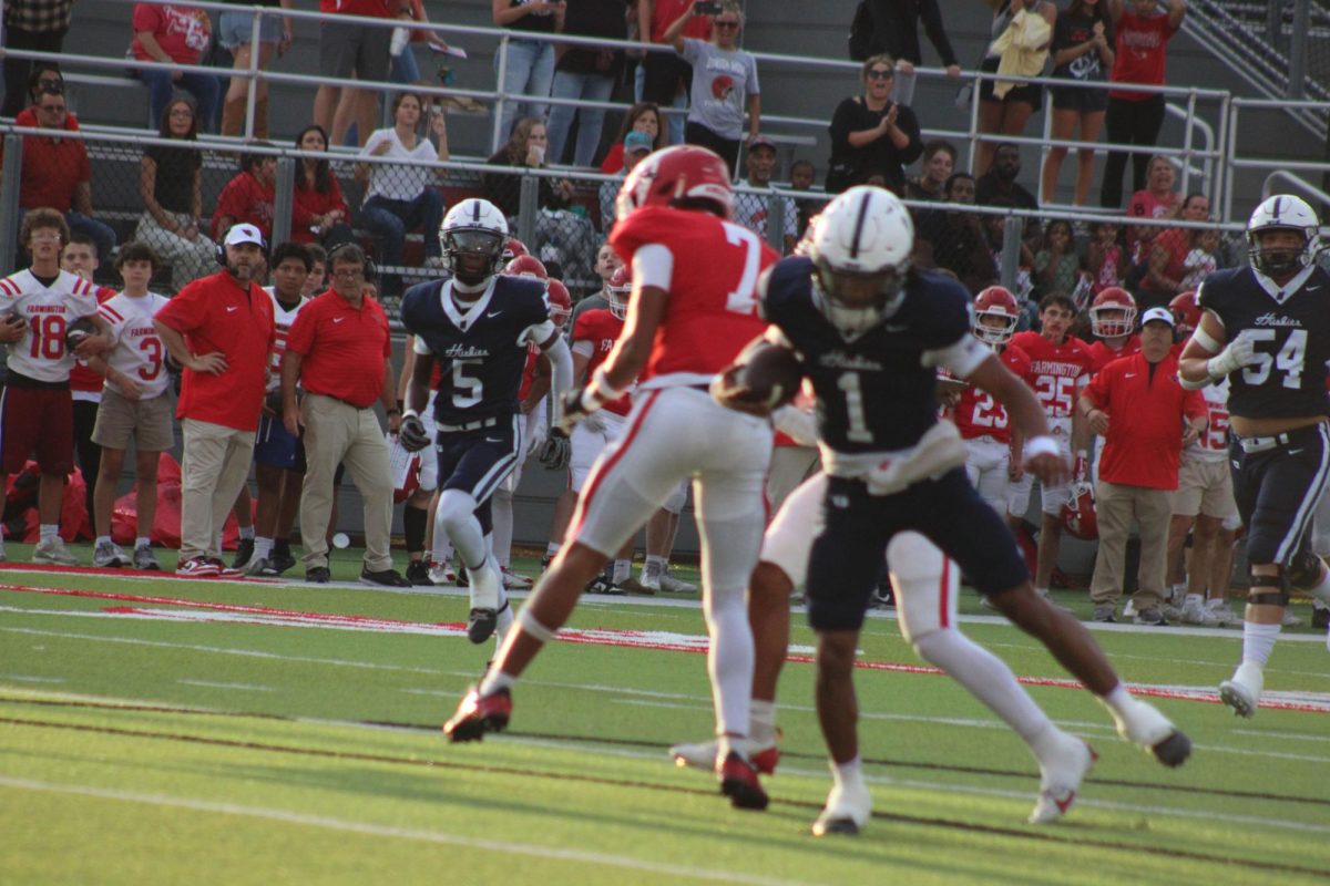 Number 1 running the ball in for a touchdown.