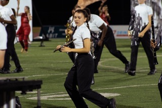 The marching band starts as mannequins, not knowing where they are, who they are or what they are.