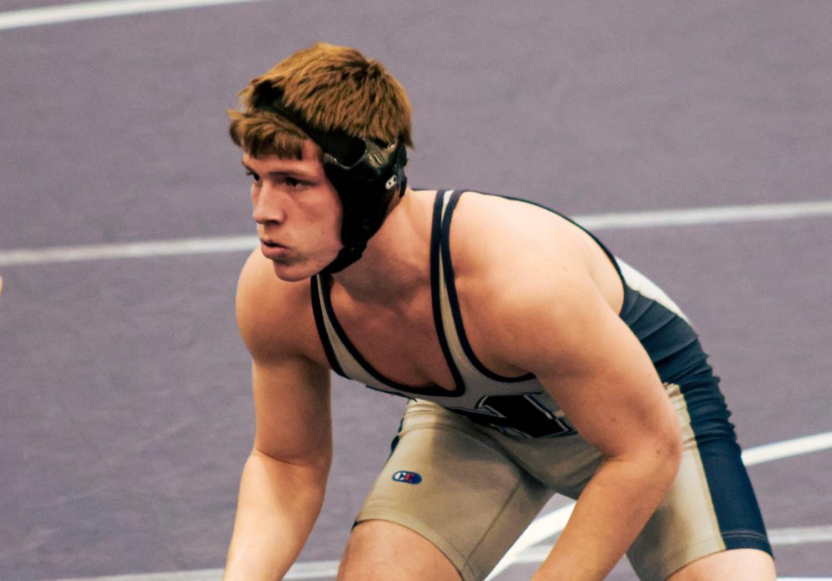 Freshman Parker McMahan setting up for his signature blast double leg takedown. His signature move proved to be effective. Edmond North finished the dual with a dominant lead of 69-6.