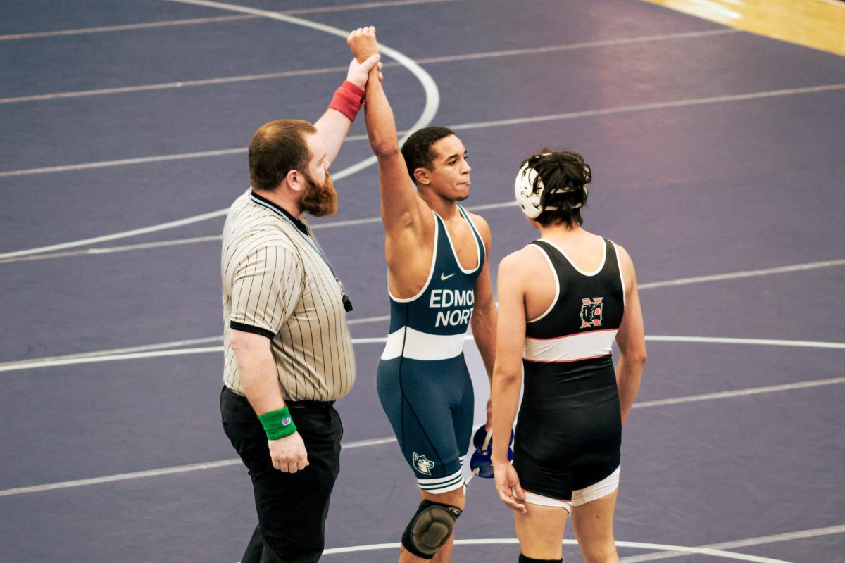 Senior Tommy Verette after pinning his opponent for the 144 pound match. This bumped the team score up to 33.