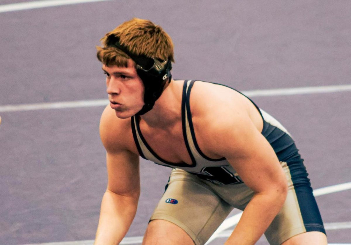 Freshman Parker McMahan sets up for his signature blast double-leg takedown. His signature move proves effective. Edmond North finishes the dual with a dominant 69-6 lead.