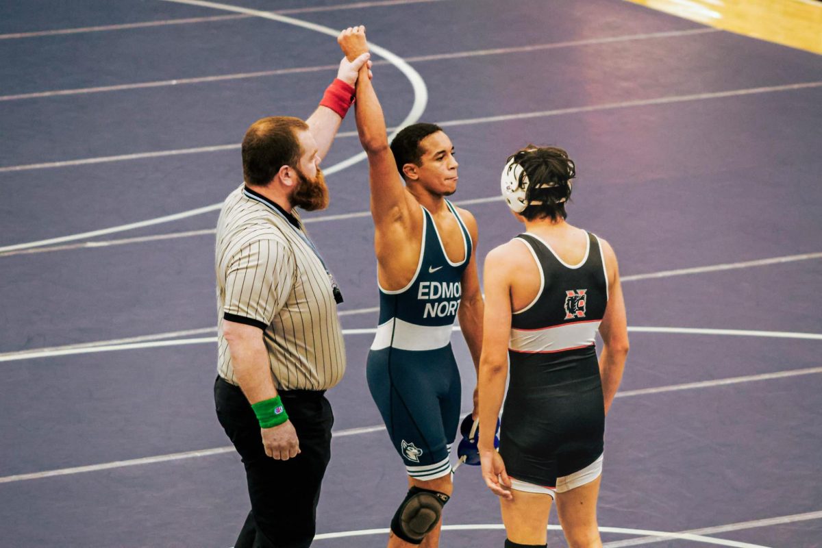 Senior Tommy Verette after pinning his opponent in the 144-pound match. This bumps the team score to 33.