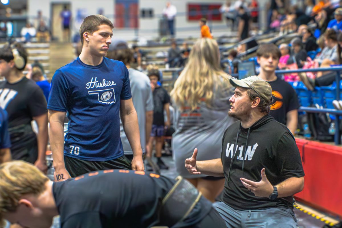 Throughout the meets, it can be difficult for Coach Dawson to make it around to support or coach all of the lifters. However, he always makes sure he is there for the lifters whenever he can. For example, here is Dawson talking to Sophomore Parker Mcmahan before attempting squatting. 