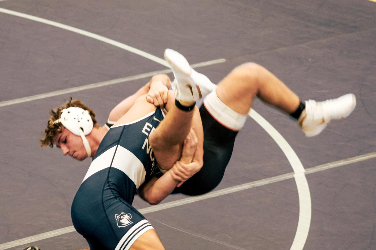 Senior Will Deutschlander finishes his takedown on the mat, soon getting the fall and earning 6 more points for the Huskies.