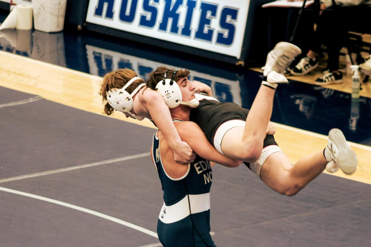 Senior Will Deutshlander picks up his opponent but slowly sets him down so the referee doesn’t stop the match for a potentially dangerous call.