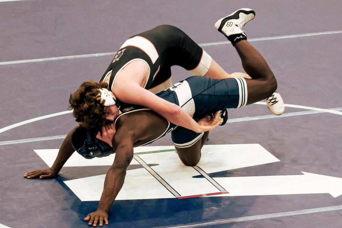 Junior Quinton Silvy keeps his feet moving to get out from the bottom position. Silvy’s fast feet keep him from getting pinned. He later gets the fall over his opponent in the third period.
